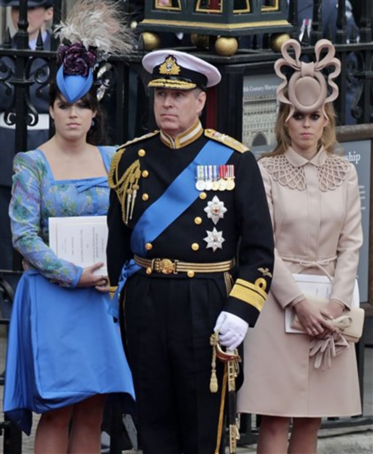 Britain's Prince Andrew, center, and his daughters Princess Eugenie, left, and Princess Beatrice leave Westminster Abbey at the royal wedding in London on April 29.  